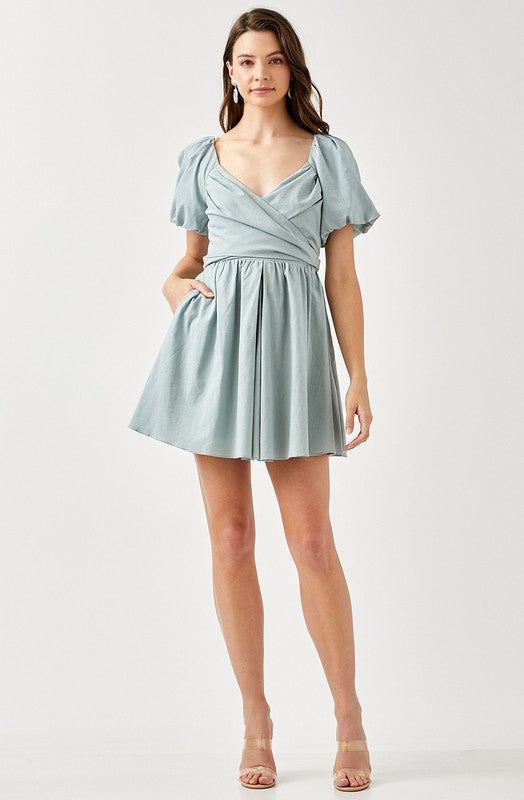 CARLINE CROSS WRAP SMOCKED BACK DRESS