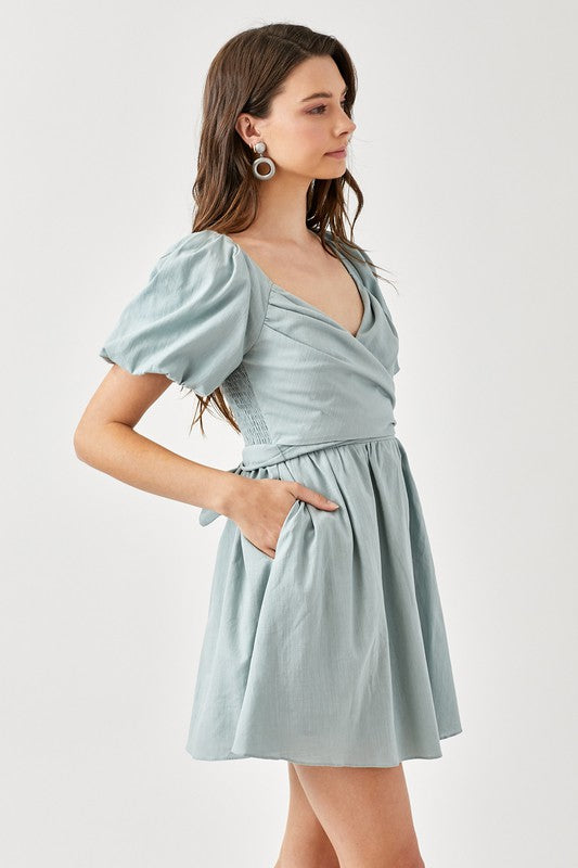 CARLINE CROSS WRAP SMOCKED BACK DRESS